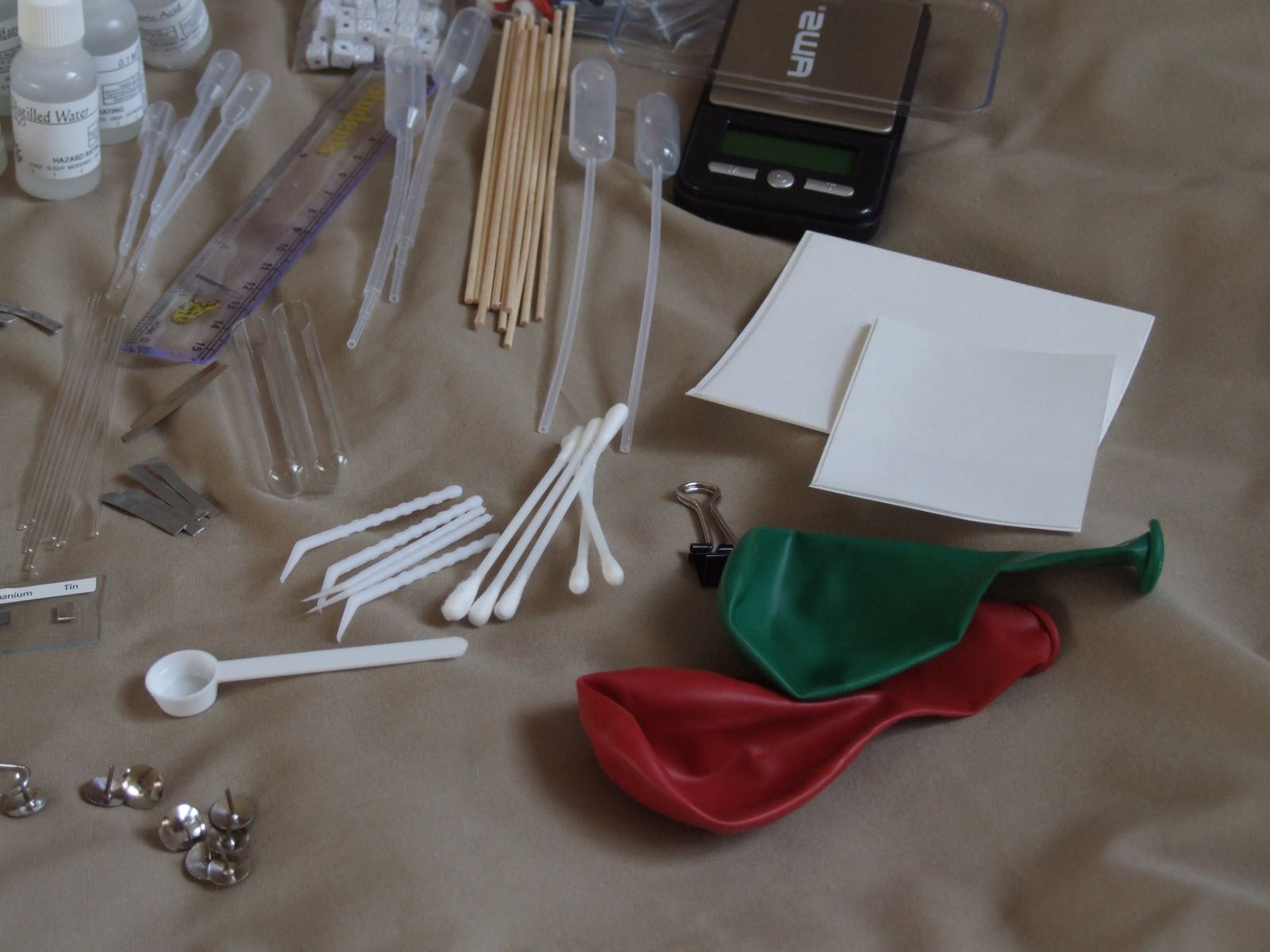 Pipettes, test tubes, stir sticks and balloons from the micro-scale procedures