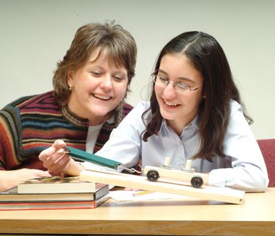 A teacher and student running the inclined-plane experiment